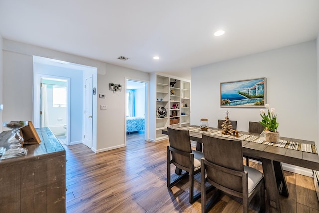 60 Bayview Dr, Huntington, NY 11743 - dining area with recessed lighting, baseboards, visible vents, and wood finished floors