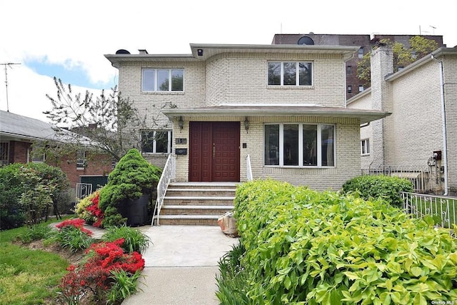 view of front of house featuring brick siding