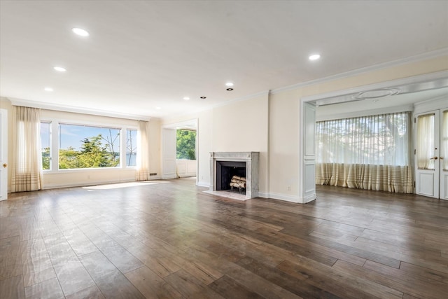 22 Shorecliff Pl, Great Neck, NY 11023 - unfurnished living room featuring recessed lighting, baseboards, ornamental molding, dark wood finished floors, and a fireplace