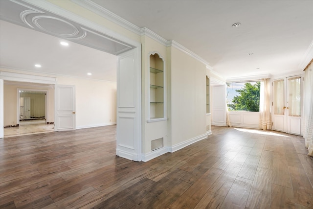 22 Shorecliff Pl, Great Neck, NY 11023 - unfurnished room with ornamental molding, built in features, visible vents, and hardwood / wood-style floors