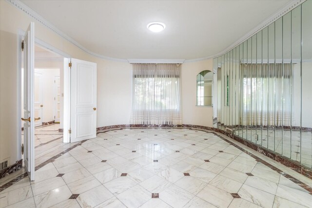 22 Shorecliff Pl, Great Neck, NY 11023 - empty room with baseboards, ornamental molding, and visible vents