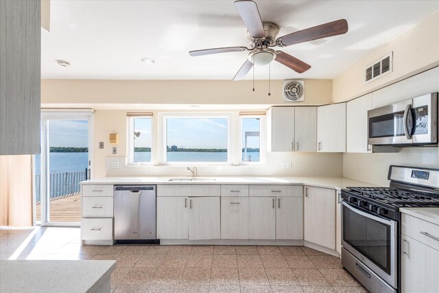 22 Shorecliff Pl, Great Neck, NY 11023 - kitchen featuring light countertops, appliances with stainless steel finishes, visible vents, and a sink