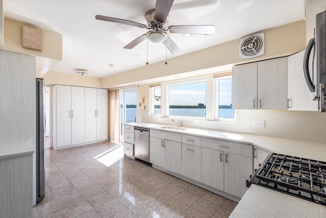 22 Shorecliff Pl, Great Neck, NY 11023 - kitchen with granite finish floor, a sink, ceiling fan, light countertops, and appliances with stainless steel finishes