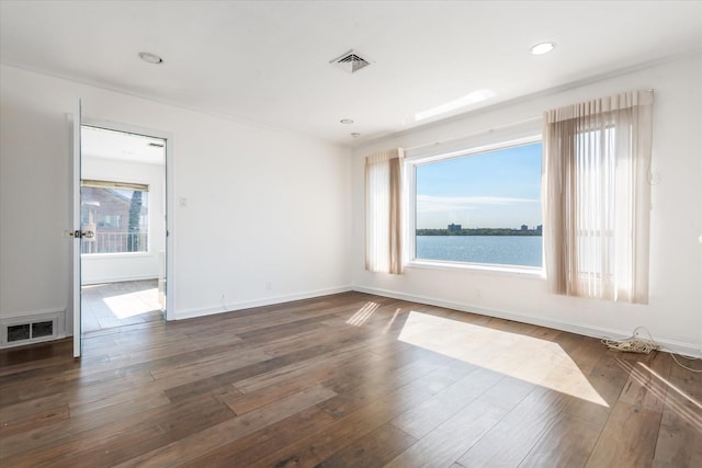 22 Shorecliff Pl, Great Neck, NY 11023 - empty room featuring plenty of natural light, baseboards, dark wood-type flooring, and visible vents