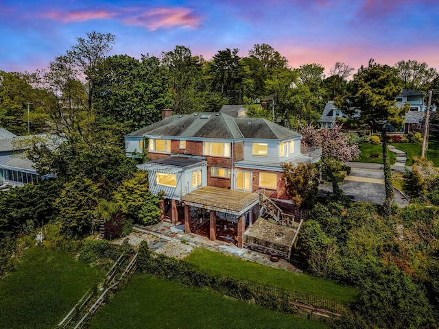 22 Shorecliff Pl, Great Neck, NY 11023 - rear view of property with a chimney and brick siding