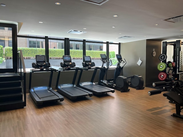 40 Broad St Unit 28H, New York Manhattan, NY 10004 - workout area featuring recessed lighting, wood finished floors, and attic access