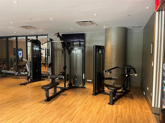 40 Broad St Unit 28H, New York Manhattan, NY 10004 - workout area featuring wood finished floors, recessed lighting, floor to ceiling windows, and baseboards