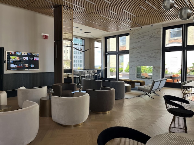 40 Broad St Unit 28H, New York Manhattan, NY 10004 - community lobby featuring a wall of windows and a wainscoted wall