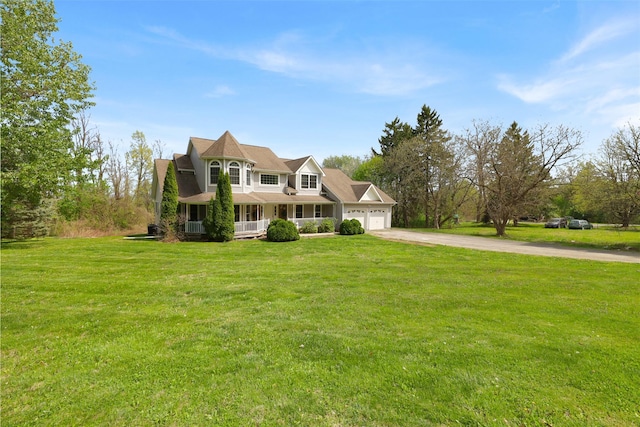14 Clarks Ln, Milton, NY 12547 - victorian home featuring a porch, a garage, driveway, and a front yard