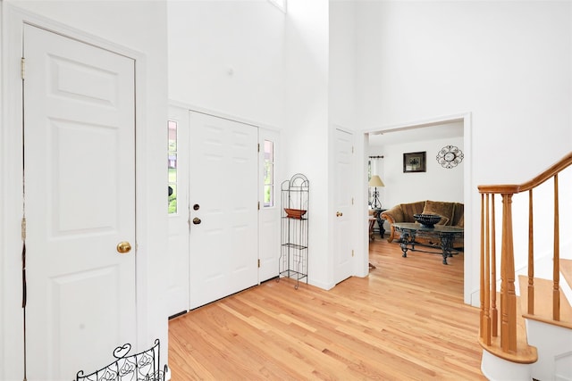 14 Clarks Ln, Milton, NY 12547 - entrance foyer featuring light wood-style flooring, stairway, and a high ceiling
