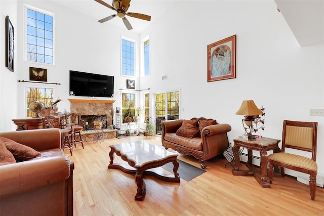 14 Clarks Ln, Milton, NY 12547 - living room with a towering ceiling, a ceiling fan, light wood-style flooring, and a fireplace