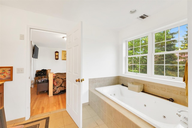 14 Clarks Ln, Milton, NY 12547 - ensuite bathroom with tile patterned flooring and a jetted tub