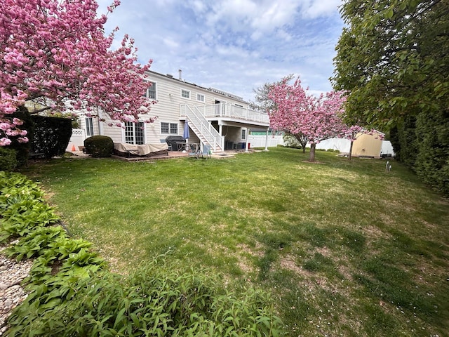 36 Shore Dr W, Copiague, NY 11726 - view of yard featuring a deck and stairs