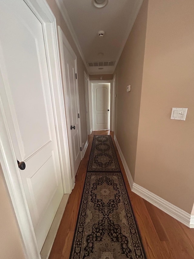 36 Shore Dr W, Copiague, NY 11726 - hall with baseboards, visible vents, and wood finished floors