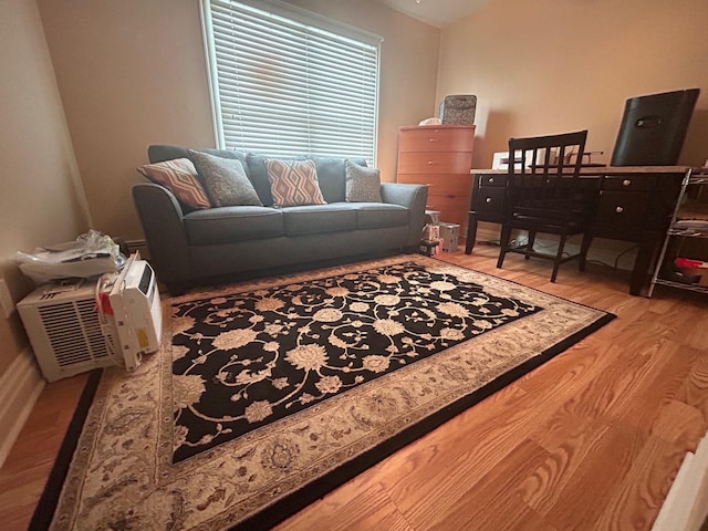 36 Shore Dr W, Copiague, NY 11726 - living area featuring baseboards and wood finished floors