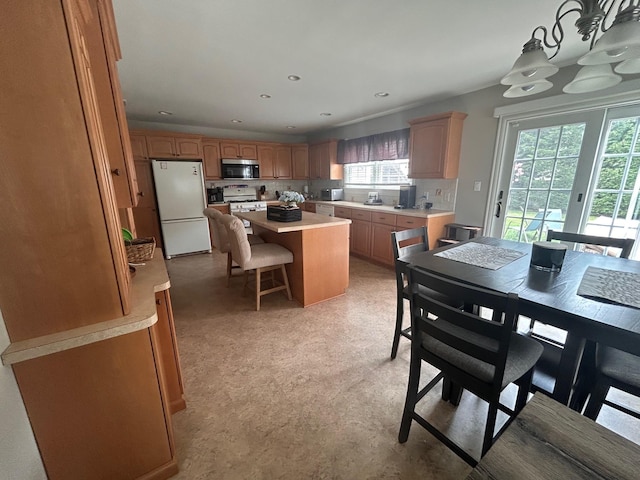 36 Shore Dr W, Copiague, NY 11726 - dining area featuring an inviting chandelier, light floors, and recessed lighting
