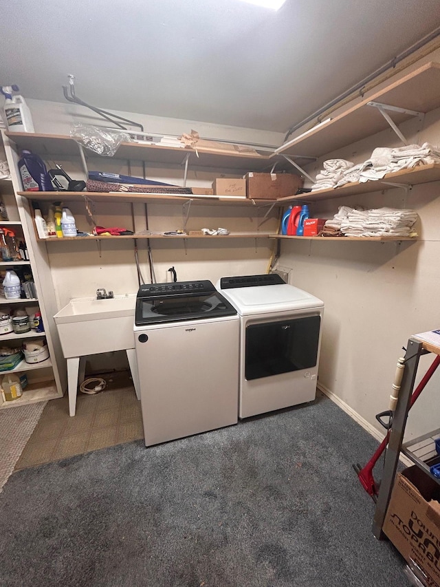 36 Shore Dr W, Copiague, NY 11726 - laundry room with baseboards, a sink, separate washer and dryer, and carpet