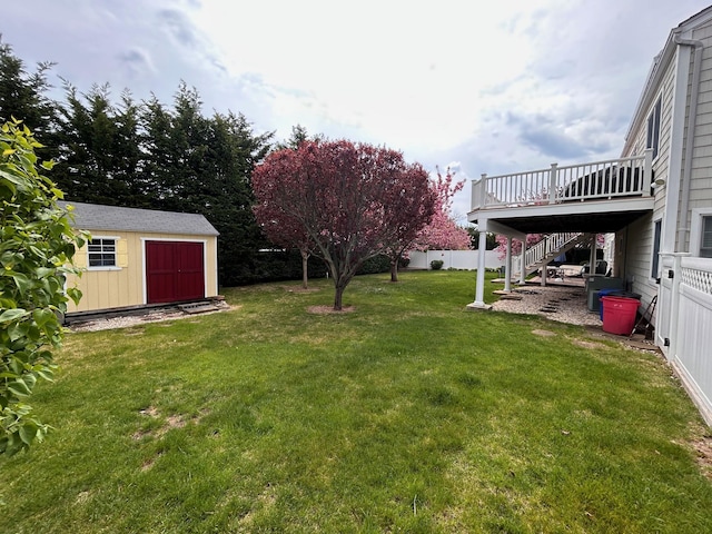 36 Shore Dr W, Copiague, NY 11726 - view of yard with fence, stairs, a deck, an outbuilding, and a shed