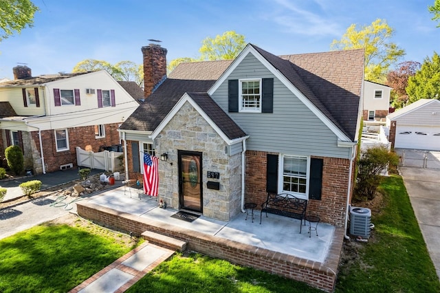 bungalow featuring fence, an outdoor structure, stone siding, central AC, and a chimney