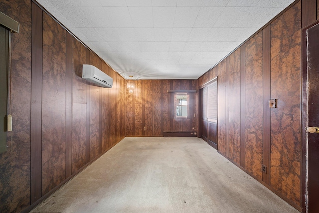 9702 159th Ave, Howard Beach, NY 11414 - empty room featuring a wall unit AC, wood walls, and light colored carpet