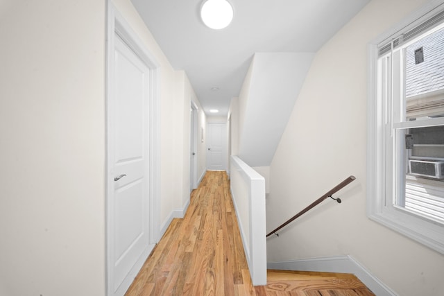 119-47 191st St, Saint Albans, NY 11412 - corridor with light wood finished floors, an upstairs landing, and baseboards