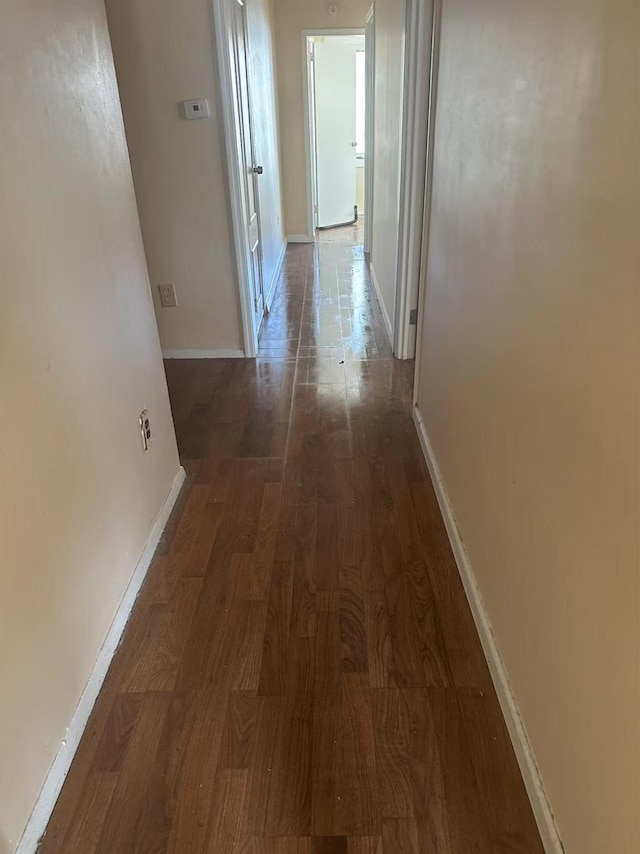 97-22 84th St, Ozone Park, NY 11416 - hallway with baseboards and wood finished floors