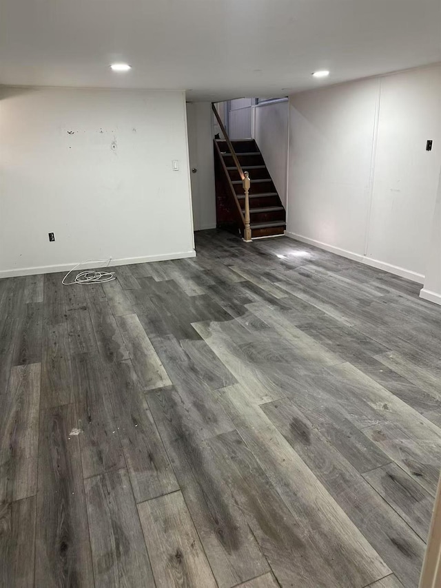 97-22 84th St, Ozone Park, NY 11416 - finished basement with dark wood-style flooring, stairs, baseboards, and recessed lighting