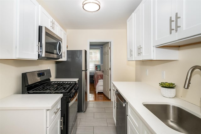 90 Union St Unit 1A, New Rochelle, NY 10801 - kitchen featuring stainless steel appliances, a sink, and white cabinets