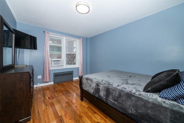 90 Union St Unit 1A, New Rochelle, NY 10801 - bedroom featuring radiator heating unit, wood finished floors, and baseboards