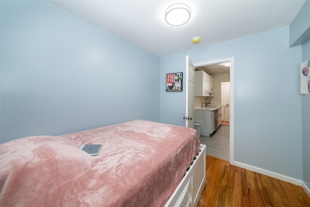 90 Union St Unit 1A, New Rochelle, NY 10801 - bedroom with a sink, light wood-type flooring, and baseboards