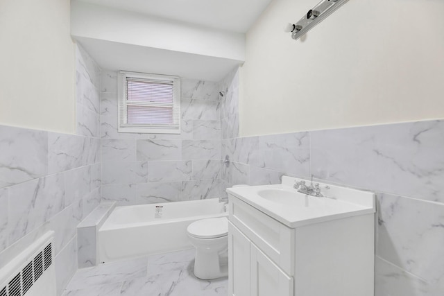 full bath with tile walls, toilet, marble finish floor, wainscoting, and vanity