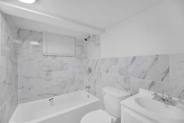 bathroom with toilet, tile walls, shower / bathtub combination, and vanity