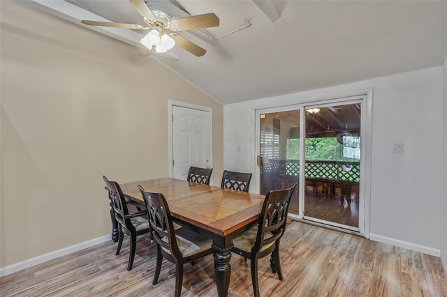 1564 Illinois Ave, Bay Shore, NY 11706 - dining room with vaulted ceiling, light wood-style floors, a ceiling fan, and baseboards