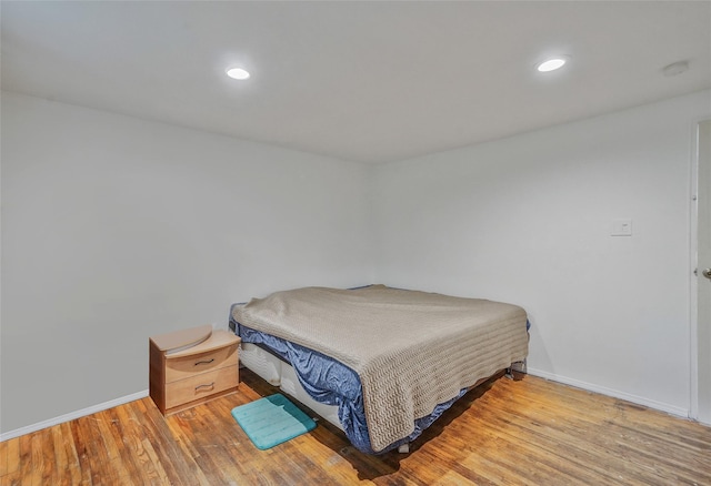 1564 Illinois Ave, Bay Shore, NY 11706 - bedroom featuring baseboards, wood finished floors, and recessed lighting