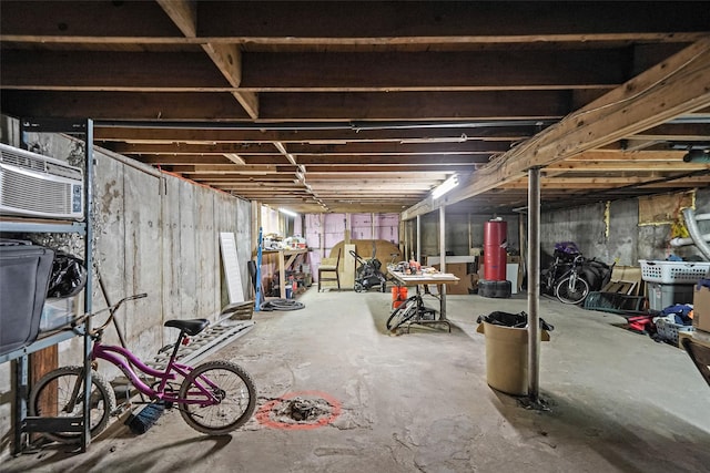 1564 Illinois Ave, Bay Shore, NY 11706 - unfinished below grade area featuring water heater and an AC wall unit