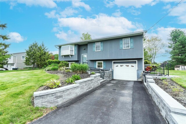 190 Lakeside Rd, Newburgh, NY 12550 - bi-level home with a front lawn, asphalt driveway, and a garage