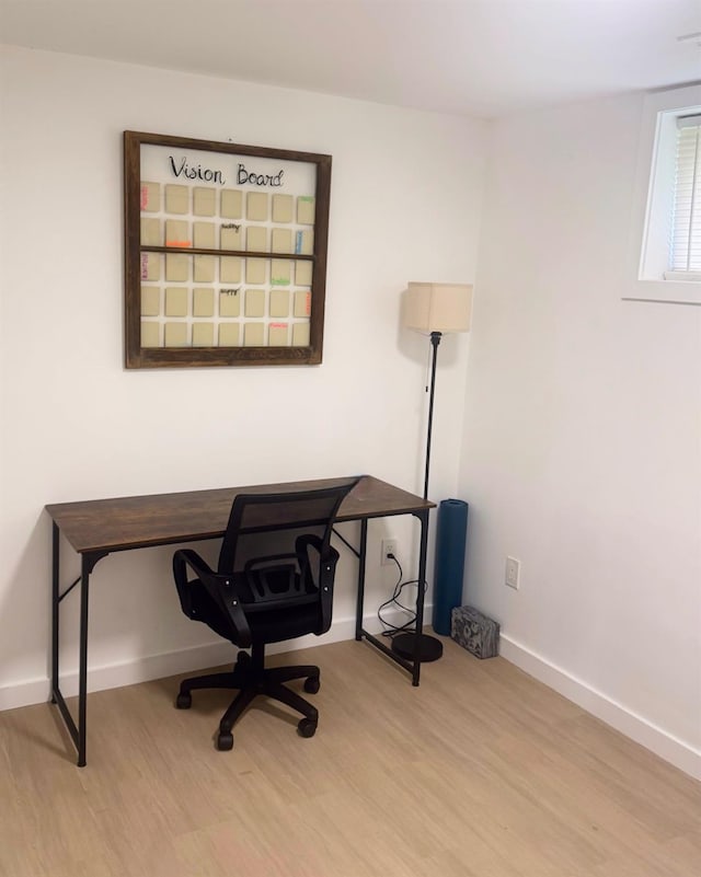 office with wood finished floors and baseboards