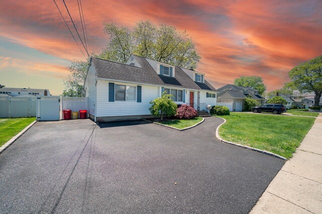 6 Pompano Ln, Massapequa Park, NY 11762 - new england style home with a gate and a shingled roof