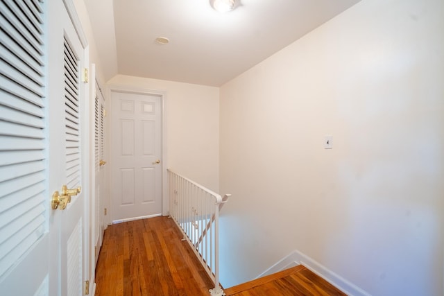 6 Pompano Ln, Massapequa Park, NY 11762 - hall featuring an upstairs landing, wood finished floors, and baseboards