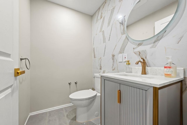 80-21 209th St, Hollis Hills, NY 11427 - half bath with toilet, tile walls, baseboards, and vanity