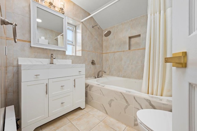 80-21 209th St, Hollis Hills, NY 11427 - full bathroom with tile walls, toilet, tiled shower / bath combo, vanity, and tile patterned floors