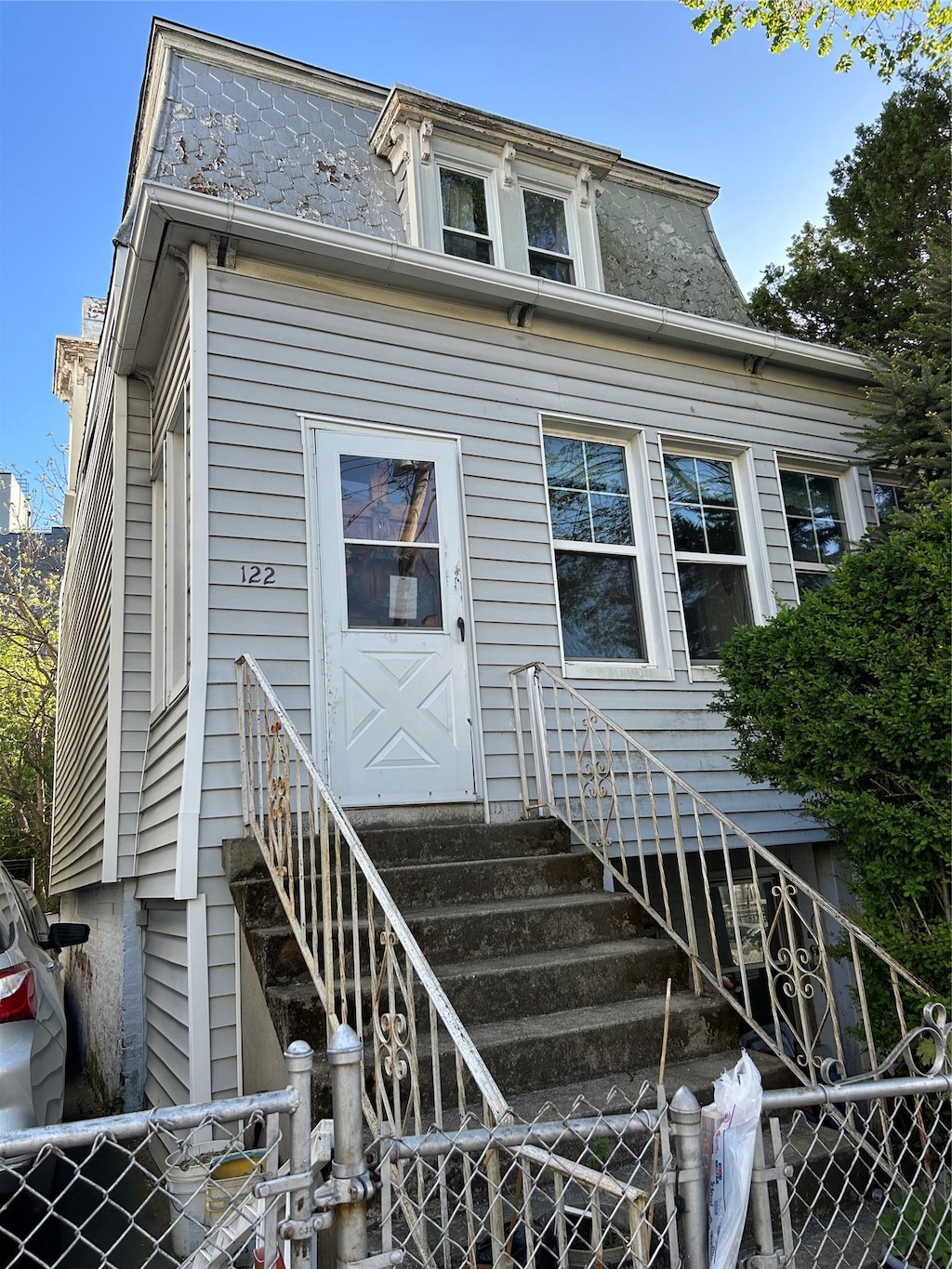 122 Oliver Ave, Yonkers, NY 10701 - second empire-style home with fence and mansard roof