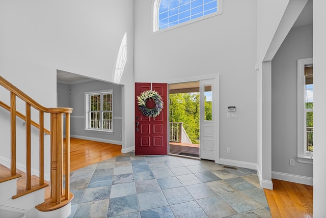 37 Shallow Stream Rd, Carmel, NY 10512 - foyer entrance with a towering ceiling, stairway, baseboards, plenty of natural light, and stone finish floors