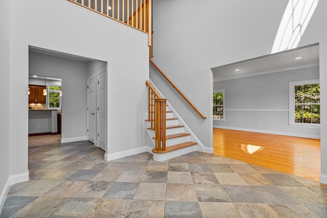 37 Shallow Stream Rd, Carmel, NY 10512 - staircase featuring stone tile flooring, baseboards, recessed lighting, a towering ceiling, and ornamental molding