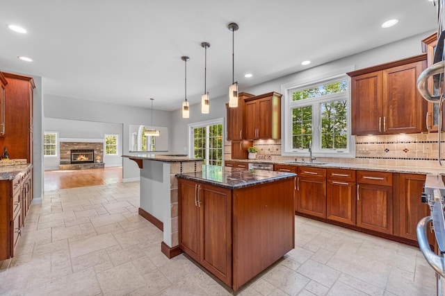 37 Shallow Stream Rd, Carmel, NY 10512 - kitchen with stone tile flooring, a sink, open floor plan, baseboards, and decorative backsplash