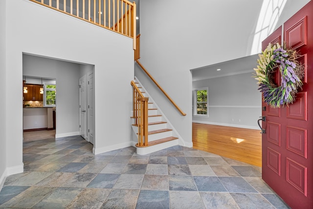37 Shallow Stream Rd, Carmel, NY 10512 - foyer featuring stone tile flooring, baseboards, a towering ceiling, and stairs