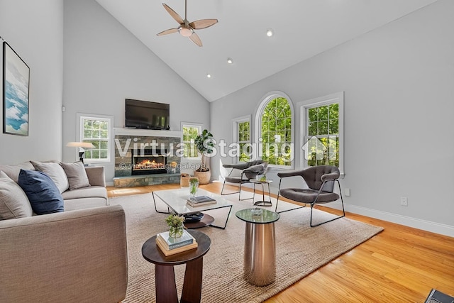 37 Shallow Stream Rd, Carmel, NY 10512 - living room with high vaulted ceiling, wood finished floors, a fireplace, ceiling fan, and baseboards