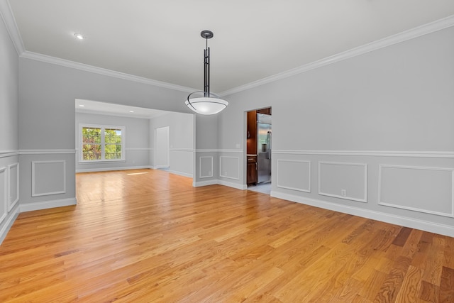 37 Shallow Stream Rd, Carmel, NY 10512 - unfurnished dining area with ornamental molding, light wood-type flooring, a decorative wall, and a wainscoted wall