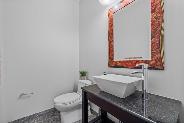 37 Shallow Stream Rd, Carmel, NY 10512 - half bath featuring a sink, toilet, and baseboards