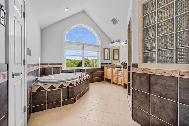 37 Shallow Stream Rd, Carmel, NY 10512 - full bath with a garden tub, tile walls, lofted ceiling, a wainscoted wall, and tile patterned flooring